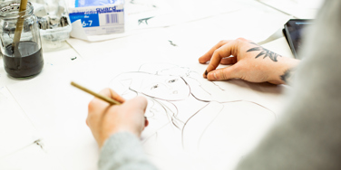 University Centre Leeds student drawing with pen