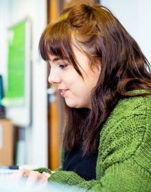 student in a green top