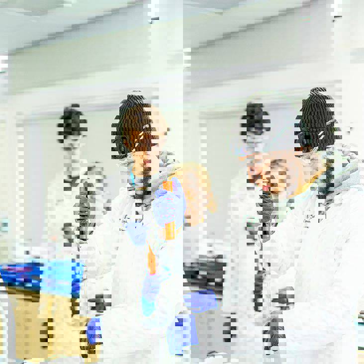 science students with a pipette