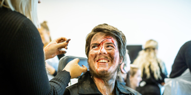 University Centre Leeds student doing make up on another student