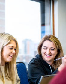 University Centre Leeds students sitting at a desk
