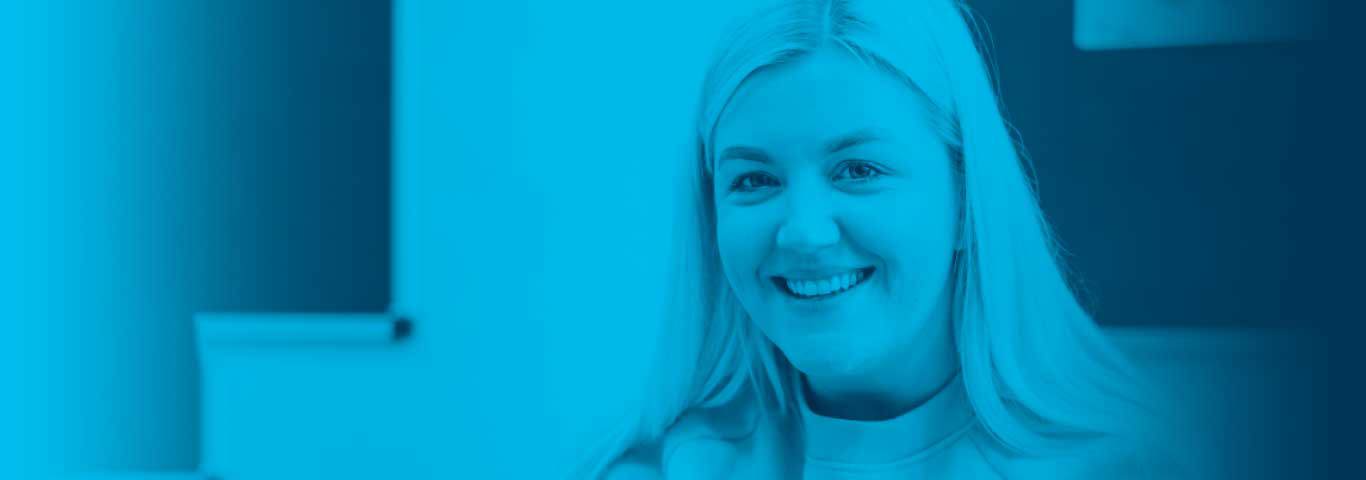 student smiling looking at the camera, blue overlay