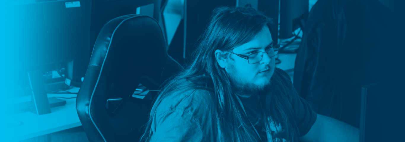 student sat in a gaming chair, blue overlay