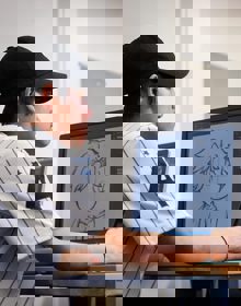 University Centre Leeds student illustrating on a computer